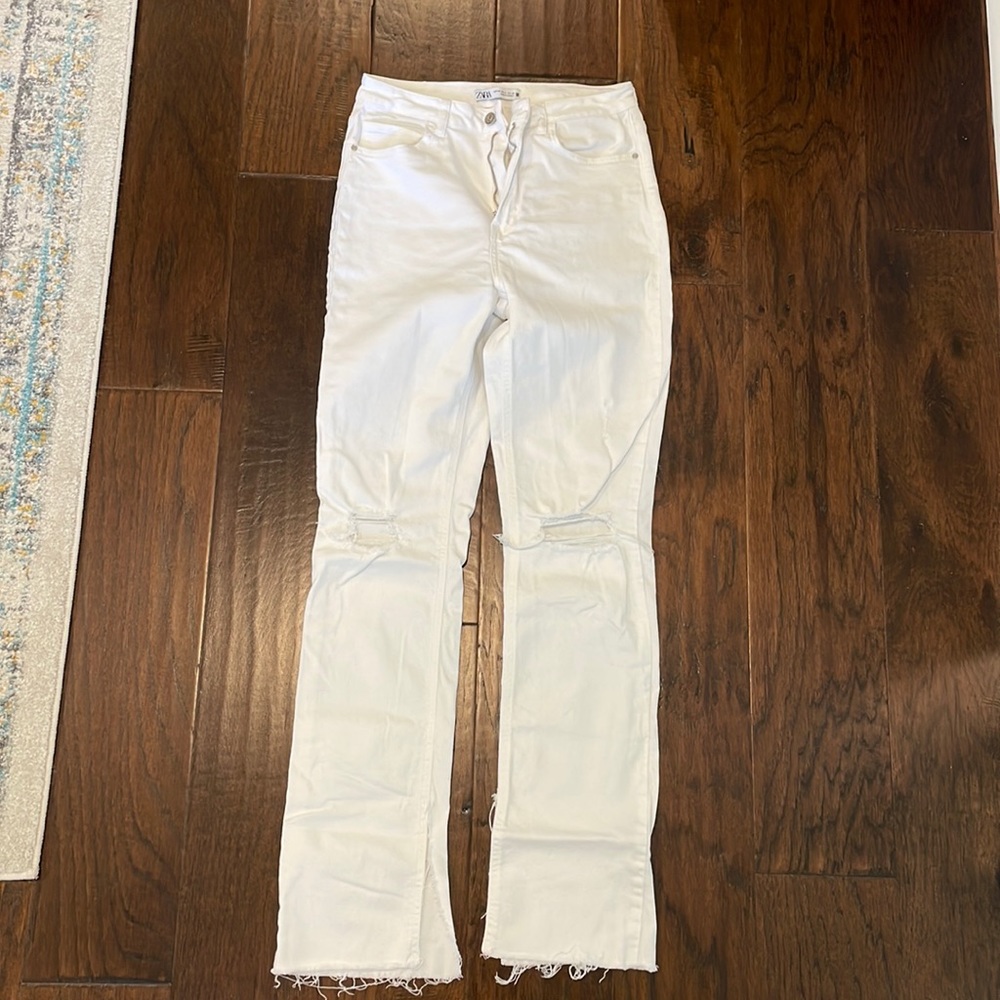 Zara US 8 White flare jeans with rips at the knee